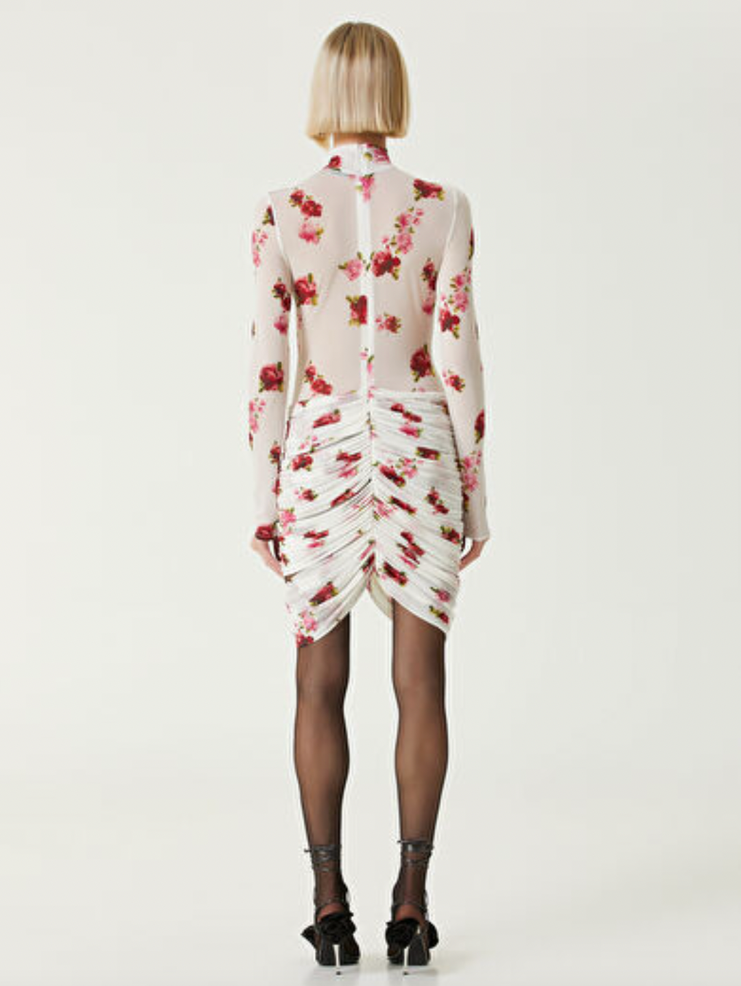Elevate your wardrobe with the Printed Jersey Mini Dress by Magda Butrym, featuring delicate rose appliqués that add a touch of romance. Crafted from soft, comfortable jersey fabric, this dress offers a flattering fit enhanced by elegant draped panels at the hem. Its unique all-over print ensures no two pieces are exactly alike, letting you stand out with effortless sophistication. Perfect for daytime events or chic evenings, this mini dress combines style and comfort seamlessly.