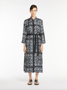 Elevate your style with the Max Mara Printed Silk Dress. The caftan-style dress is crafted from exquisite, printed silk that gives it a beautiful flow. With its slightly flared silhouette, mandarin collar, and matching belt, this dress accentuates your waist for a flattering look. Finished with hidden mother-of-pearl buttons and a back pleat for added elegance.