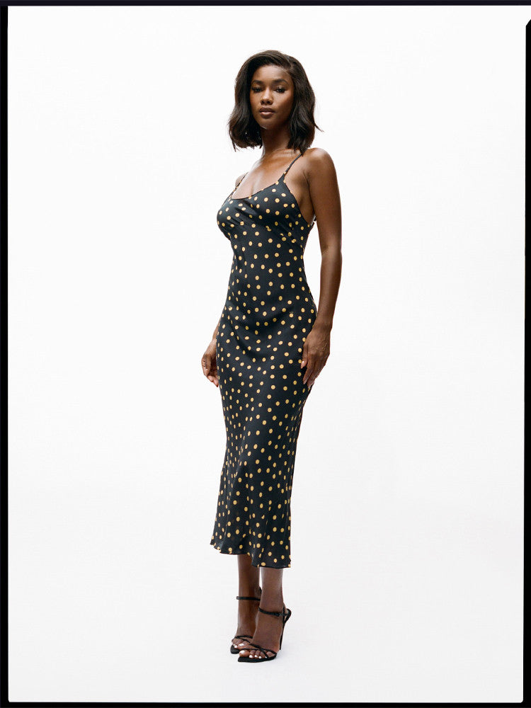 Indulge in the effortless elegance of the Iggy Dress. The 90's inspired slip dress features a flattering ankle length and fish-tail hem, with a scooped bust and low back for a touch of allure. Adjustable back straps ensure the perfect fit, while the bias cut skirt drapes beautifully in 100% silk crepe. No lining needed for a sleek and luxurious feel.