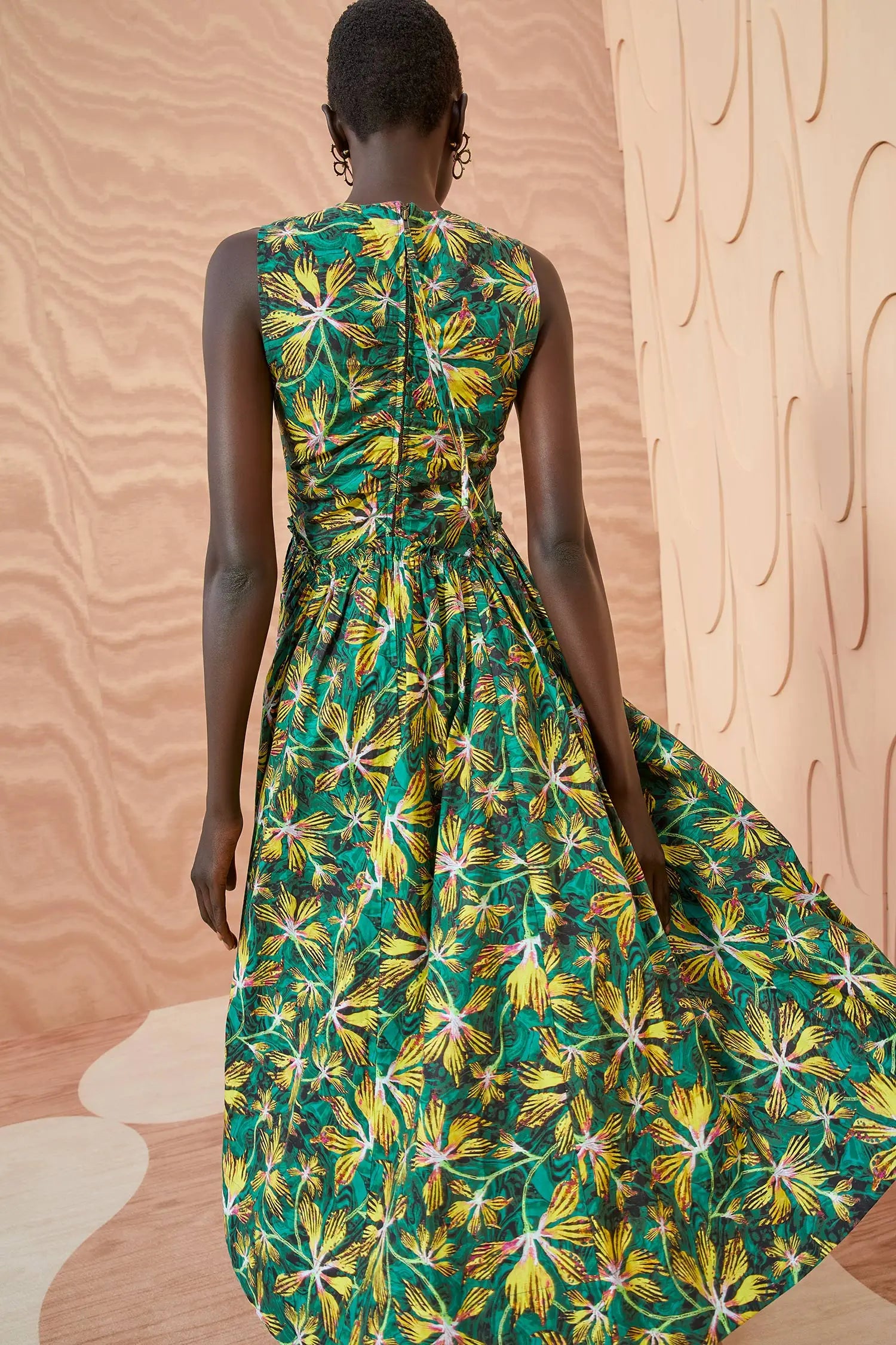 Crafted from the highest quality signature cotton poplin, the Mimi Dress is a stunning and vibrant piece. Its emerald green, yellow, and pink hues are perfectly complemented by delicate ruching along the bodice and waist. The full A-line skirt and center-back zipper offer both comfort and sophistication.