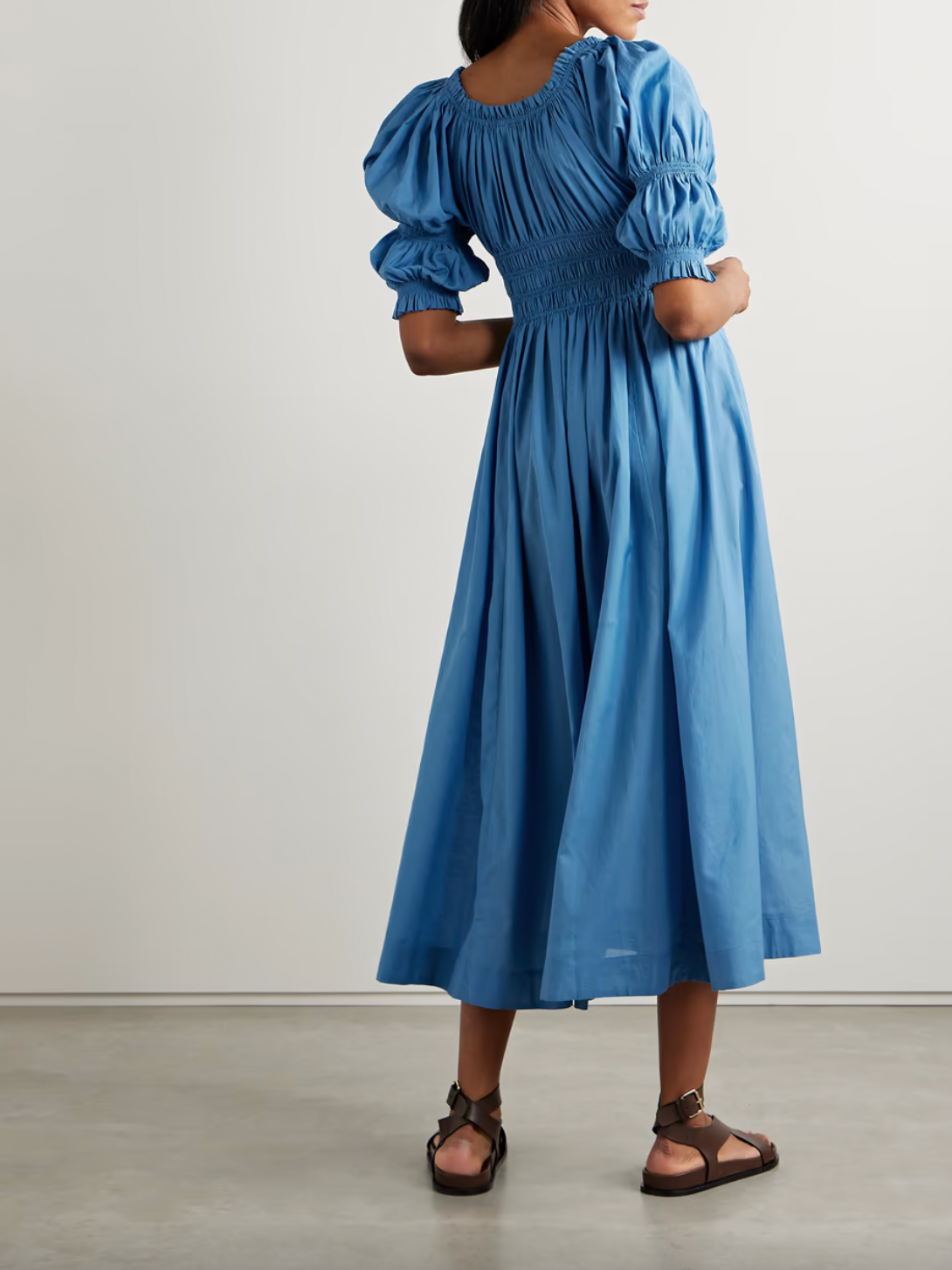 Indulge in the romantic and breezy style of the Ischia Dress. Made from a soft and lightweight cotton-blend voile, it features elegant puffed sleeves and flattering shirred panels that cinch in at the waist. Perfect for any occasion, pair with slides or mules for an effortless and chic look.