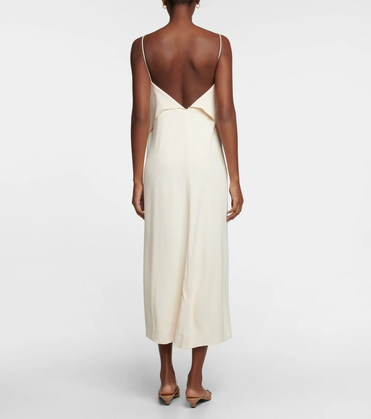 This slip dress from Toteme is made from supple twill. It has a straight silhouette, a draped and layered front with wispy shoulder straps, and a midi hem.