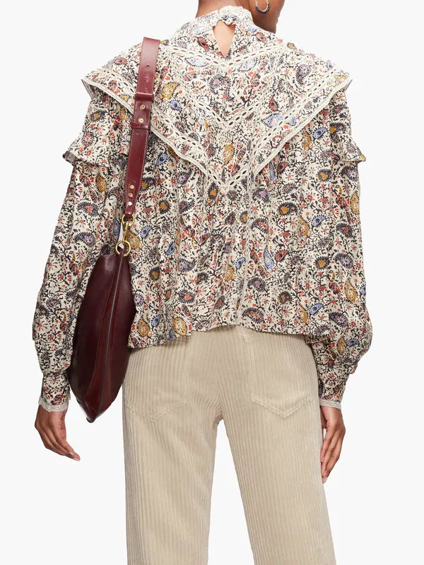 Step into the free-spirited 70s with the Reign Ruffled Paisley-Print Blouse! Adopted by icons like Janis Joplin and Jimi Hendrix, this Isabel Marant Étoile blouse exudes bohemian charm with its multicoloured paisley pattern. Lightweight poplin and delicate lace-trimmed ruffles add a feminine touch. Pair with tailored trousers for a stylish contrast.