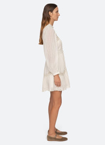 Stay comfortable and chic in the Haven Dress by Sea NY. Crafted from soft cotton, this dress features long puff sleeves, delicate lace insets, and trim detailing. Perfect for a day at the beach or a casual outing, it's a must-have for your wardrobe.