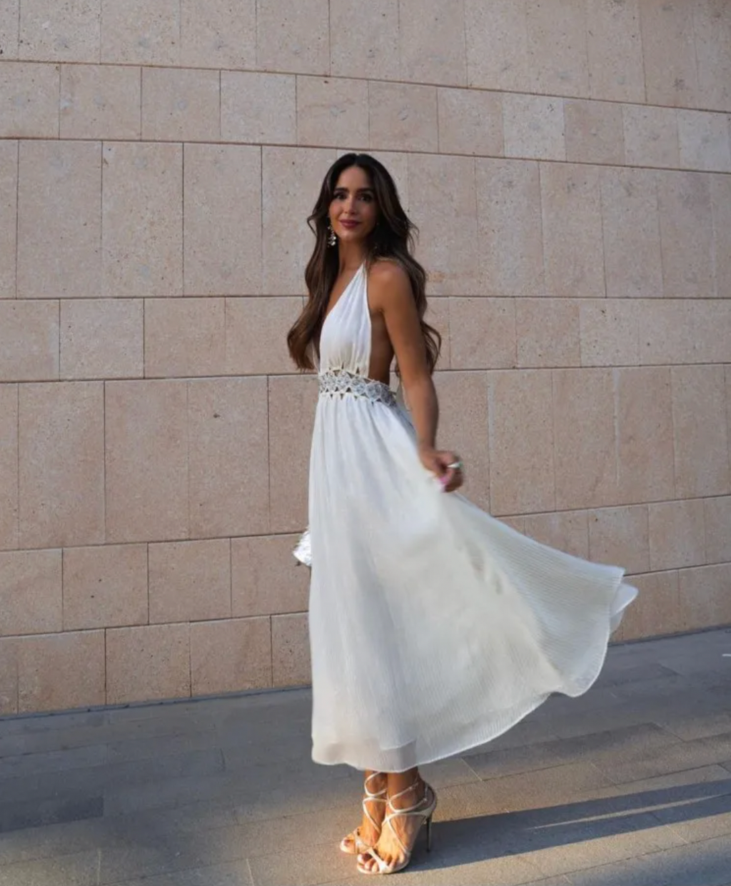 Indulge in the luxurious charm of our Rosalinda Dress. Made with cotton, this bohemian white dress features intricate sequin and pearl detailing. The sleeveless design and high waist create a flattering A-line silhouette, while the open back adds a touch of allure. Elevate your style with this dreamy, ethereal piece.