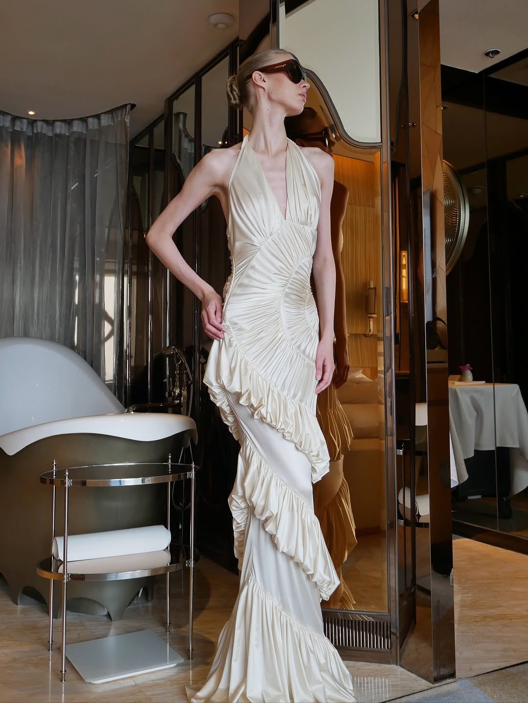 The Ammonite Gown by Datt combines elegance with practical comfort. Crafted from soft mesh that drapes beautifully against your skin, this fitted piece features a convenient side zip for effortless dressing. The included separate bikini lining ensures you're covered and confident underneath, making this gown versatile enough for any occasion where you want to feel polished and put-together.