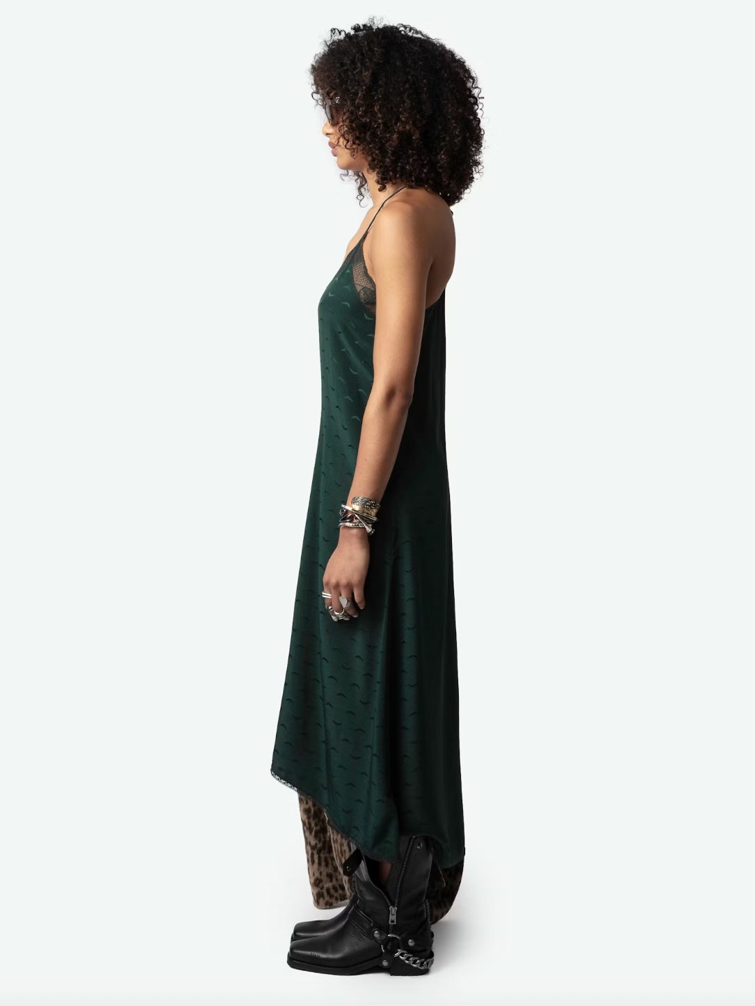 Experience ultimate luxury in the Risty Wings Silk Jacquard Dress by Zadig & Voltaire. Made from the finest Peaks dark green silk, this lingerie-style maxi dress features a delicate jacquard wings design and lace strips. The v-neckline, thin non-adjustable straps, and asymmetrical bottom add an alluring touch.