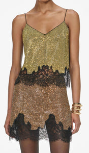 Elevate your evening wardrobe with the Champagne Crystal Set—a dazzling combination of a relaxed-fit chainmail top and a flirtatious mini skirt. The top features champagne crystals, lace-trimmed hem, button-back closure, and full lining for comfort and polish. The matching fitted mini skirt, detailed with delicate lace trim and a back zipper, offers subtle allure with its minimal stretch and unlined finish. 