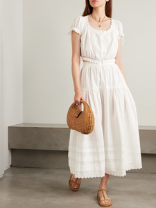 Inspired by Edwardian bridal tradition, this Sebastiane skirt combines timeless elegance with modern sustainability. Crafted from organic cotton-poplin, its tiered silhouette features delicate pintucks and elegant broderie anglaise trim, adding a touch of vintage charm to your wardrobe. Perfect for those who appreciate refined detail and eco-conscious fashion.