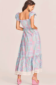 LoveShackFancy's Emeka Dress is an afternoon delight in 100% cotton gingham with a mixed plaid print and custom lace trim. This airy sundress has a sweetheart neckline framed by shirred elastic panels and flutter sleeves. A tie at center bust is functional above a cutout at the midriff. Below an elastic waistband, the skirt has side-seam pockets and flows to a flounce at bottom. Shown here in Candyland Multi.