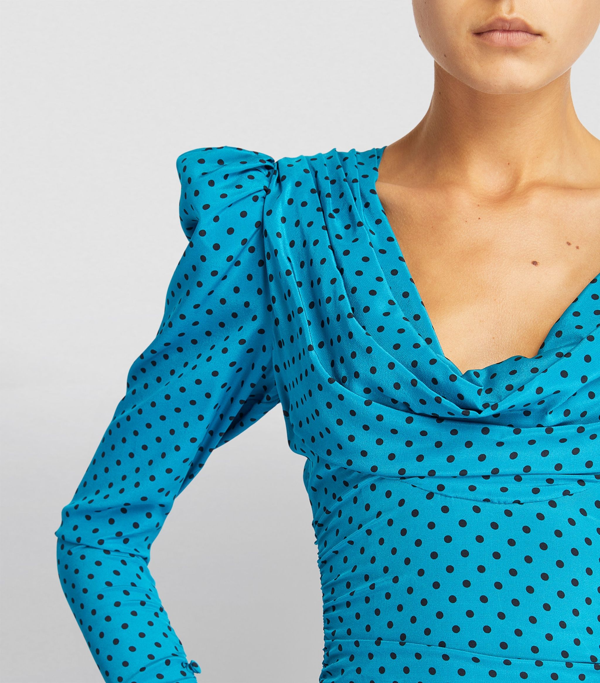 Expertly designed and crafted, the Alessandra Rich Polka-dot Silk Draped Mini Dress is a luxurious addition to any wardrobe. Made from high quality silk, this dress boasts a stunning blue dot design and flattering draped silhouette. Elevate any occasion with this sophisticated and timeless piece.