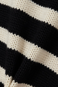 This striped wool-blend turtleneck sweater from TOTEME combines timeless style with cozy comfort. Crafted from a soft blend of wool and organic cotton, it features a relaxed fit and a classic turtleneck, making it perfect for layering. The iconic stripes add a refined touch, while the breathable fabric ensures warmth without bulk. Pair it with tailored pants for an effortlessly polished look that lasts season after season.