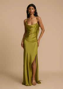 Looking for a dress that combines boldness and elegance? Look no further than the Odessa Dress! With subtle tucks at the side hip for structure and harmony, delicate spaghetti straps and a daring thigh-high slit, this dress is tailored to captivate. The asymmetrical deep V back and cascading satin details add the perfect finishing touches. Take a risk and stand out in the Odessa Dress.