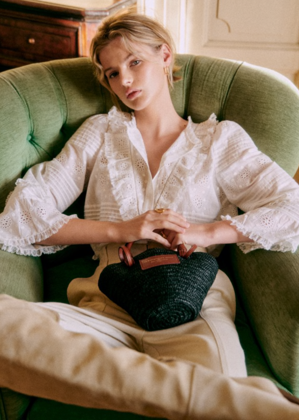 Elevate your wardrobe with the Nele Blouse. Showcasing intricate embroidered detailing and 3/4 length sleeves, this blouse exudes effortless elegance. The high ruffled collar, front ruffles, and pleat details add a touch of sophistication. Finished with delicate mother of pearl buttons, this blouse is the epitome of luxury fashion.