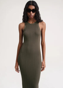 Elevate your style game with our TOTEME Khaki Seamless Midi Dress. Made from a luxurious rib knit blend of viscose and recycled nylon, this dress molds to your body for a flawless fit. Perfect for any occasion, this dress exudes sophistication and exclusivity.