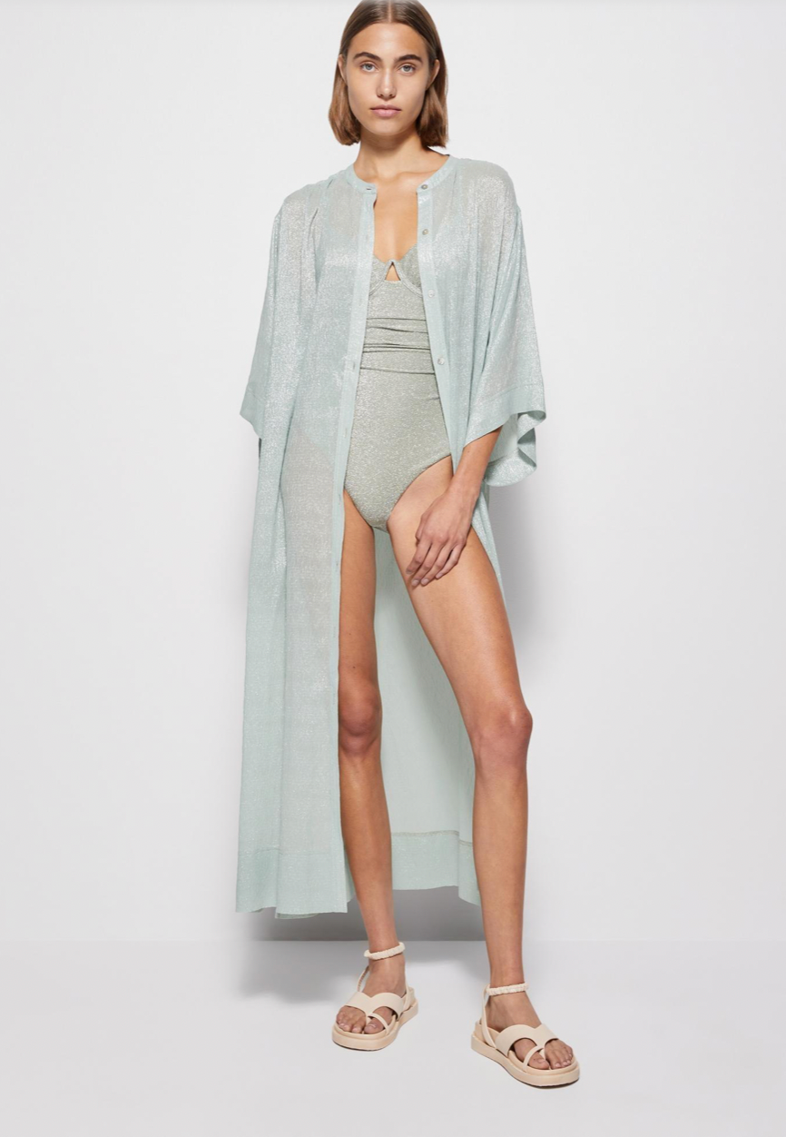 Get ready to hit the beach in style with our Coverup Odelia Maxi! Featuring a stunning seafoam color and made from high-quality material, this coverup will make you stand out on the sand. Made by Jonathan Simkhai, our maxi provides both style and comfort for all your seaside adventures.