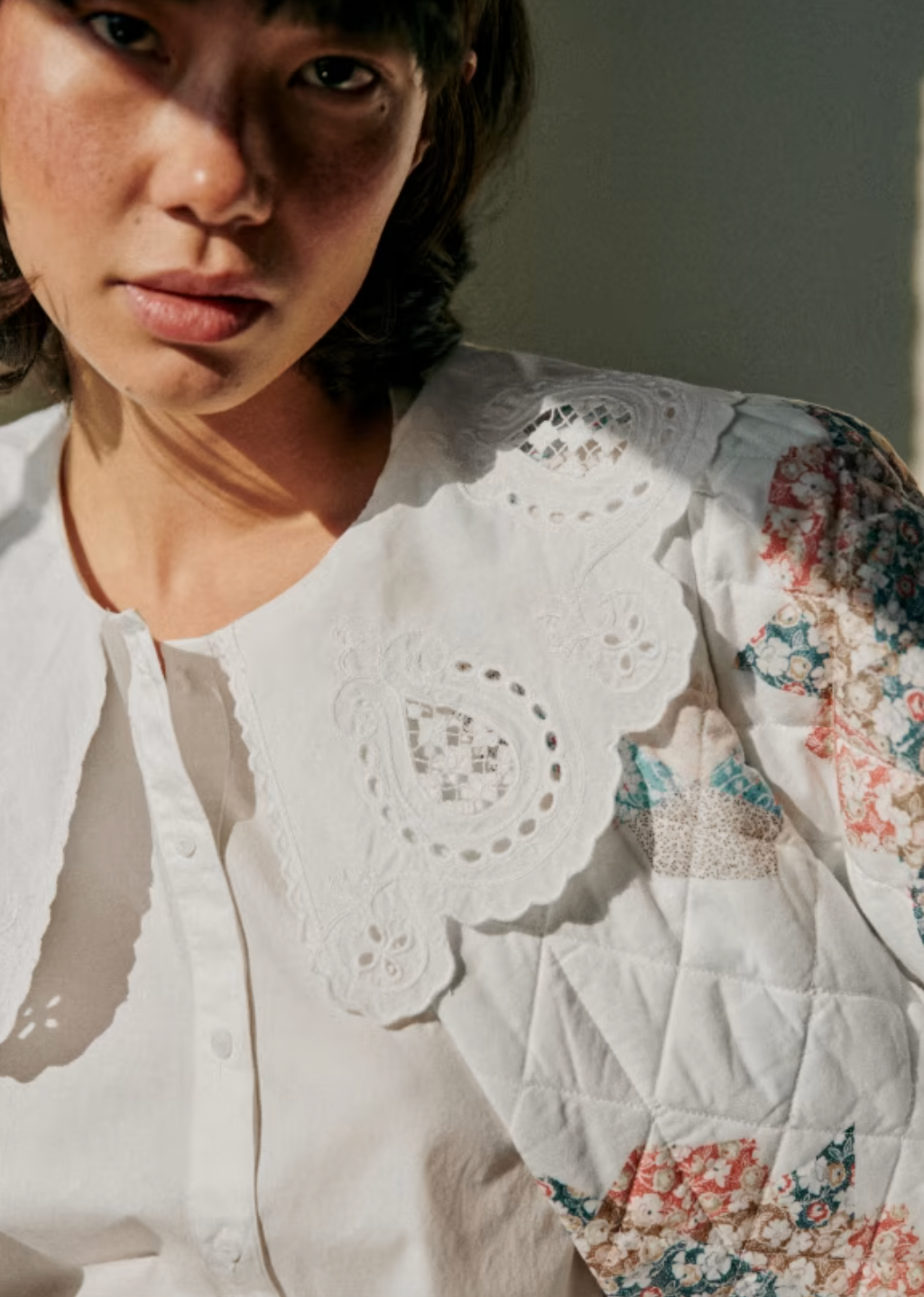 The Flavie Shirt by Sezane combines timeless elegance with a standout design featuring a large embroidered collar that adds a touch of sophistication to your look. Its long sleeves and buttoned front offer both comfort and versatility, making it perfect for dressing up or down. Elevate your wardrobe with this statement piece that effortlessly blends classic style and unique detail.