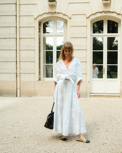 Elevate your wardrobe with this expertly crafted high-waisted maxi skirt by Rotate Birger Christensen, designed in sustainable organic cotton. Its voluminous, flared silhouette offers graceful movement, while tonal floral embroidery enriches the texture with subtle, refined detail. Thoughtful tailoring, including soft gathering at the waistband and a discreet side zipper, guarantees a smooth, flattering fit tailored for lasting comfort and style. 