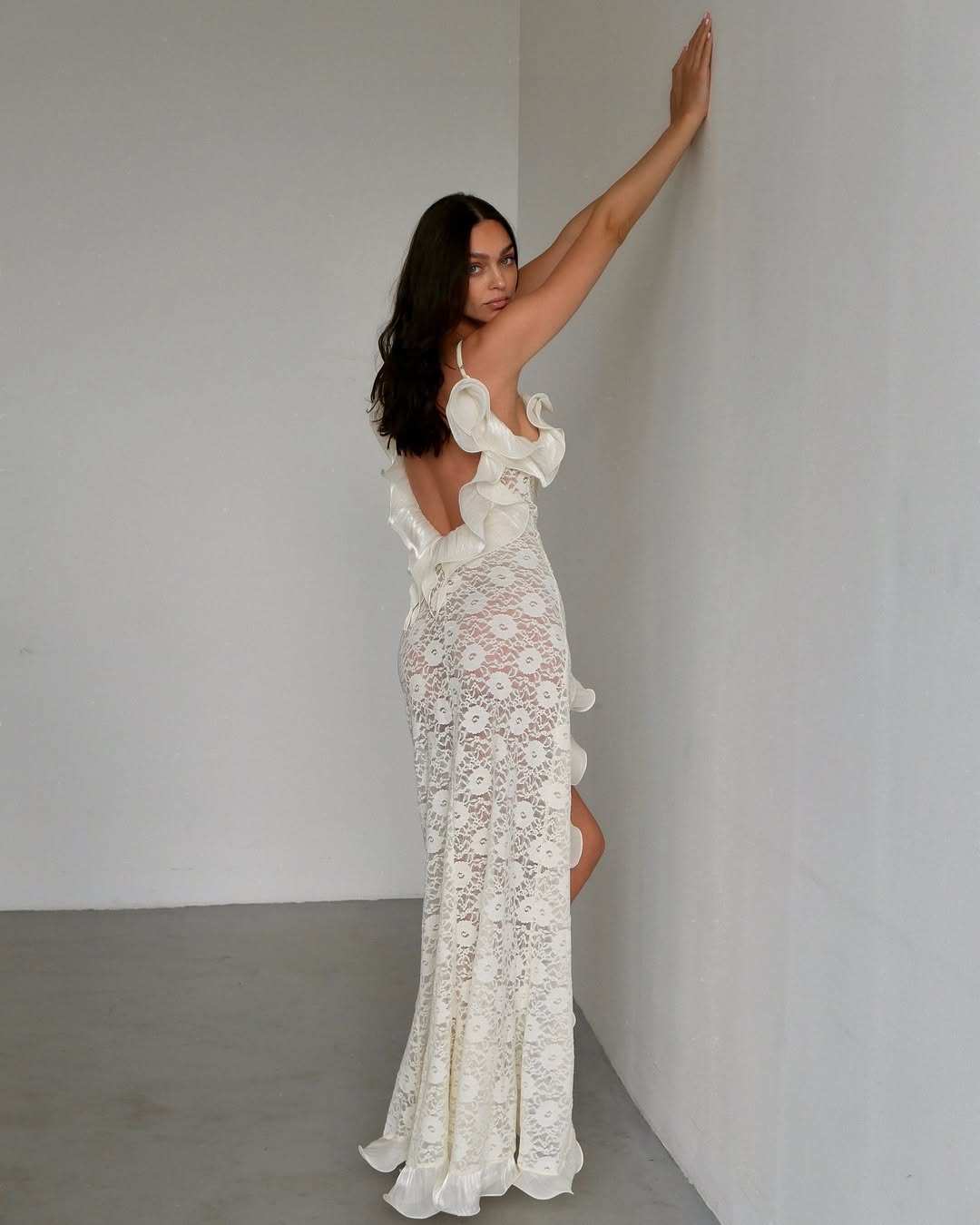The Elisabetta dress is a graceful maxi length gown that emphasizes femininity and gives the a sophisticated look. A plunging neckline on the back adds a touch of seductiveness, while delicate organza ruffles and adjustable straps provide comfort and a perfect fit. This dress is created individually to emphasize your uniqueness and give you a sense of exclusivity.
