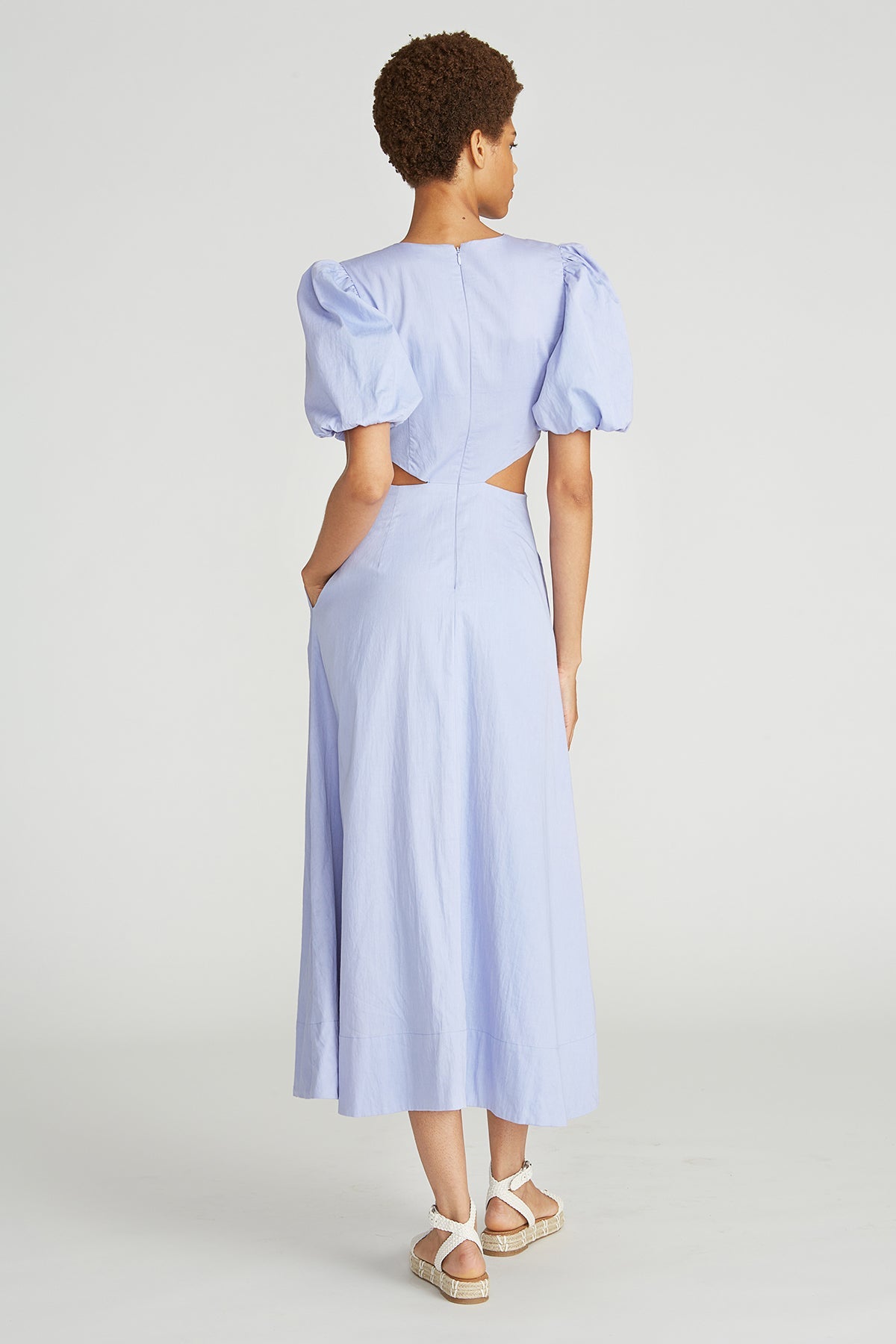Effortlessly slip into the crisp cotton poplin Gio midi dress, featuring delicate puff sleeves, intricate leaf embroidery, and flattering cutouts along the waistline. A versatile and feminine addition to any wardrobe.
