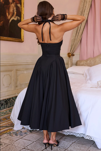 Indulge in old-Hollywood glamour with a modern twist in our Marilyn Midi Dress. Made from soft peached twill in classic black, this dress features tied halter straps, a plunging neckline, cinched waist, and a flattering silhouette. Channel your inner starlet and turn heads in this stunner!