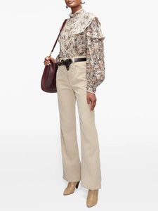 Step into the free-spirited 70s with the Reign Ruffled Paisley-Print Blouse! Adopted by icons like Janis Joplin and Jimi Hendrix, this Isabel Marant Étoile blouse exudes bohemian charm with its multicoloured paisley pattern. Lightweight poplin and delicate lace-trimmed ruffles add a feminine touch. Pair with tailored trousers for a stylish contrast.