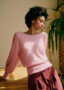 The Gaby Jumper is expertly crafted with a blend of super kid mohair and wool for a luxurious feel. With long sleeves and a slightly ballooned design, this jumper features a covered heart shape for a unique touch. Wear it with the V-neck opening in front or switch it up with the back opening. Elevate your style with this versatile and sophisticated jumper.