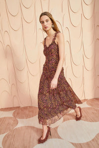 Expertly crafted from lightweight silk crinkled chiffon, the Rosaria Dress boasts a playful micro-painted leopard print in shades of pink and brown. This sleeveless midi dress features delicate ruffle trims, a flattering silhouette, and a hidden back zipper for easy dressing. Fully lined for added comfort.