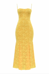 Cut from delicate burnout lace, the Joan Lace Dress elegantly celebrates femininity with refined craftsmanship. Its dainty trimmed neckline and straps lead to an open back fastened with satin ties, allowing a personalized fit. The dress gracefully skims the figure, extending into a floor-length maxi silhouette that flares into a sophisticated godet skirt, adding movement and timeless glamour to this exquisite piece.