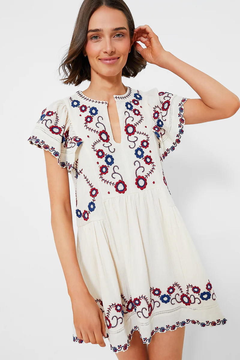 The Soren Embroidery Short Sleeve Dress by Sea New York features a split V-neckline and delicate embroidered detailing, combining elegance with effortless wearability. Its short flutter sleeves and gathered skirt create an A-line silhouette that offers a relaxed yet refined fit, ideal for versatile styling. In a cream multi palette, this mini dress balances romantic charm with modern ease, making it perfect for both casual days and more polished occasions. 