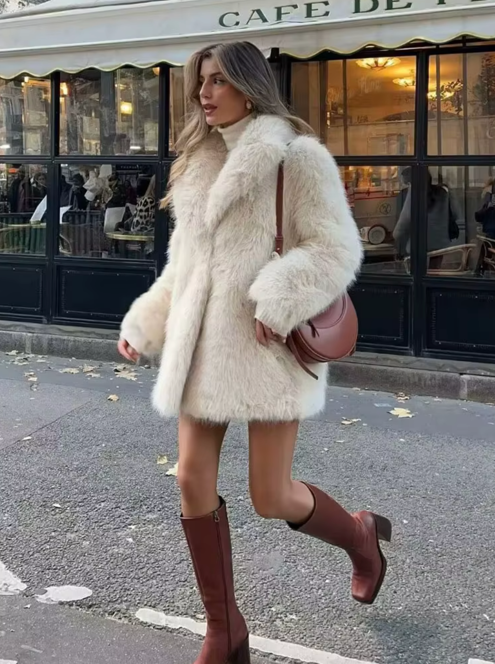 Elevate your winter style with the luxurious Blancha Shearling Coat. This long-sleeved coat features a faux fur lapel, providing both warmth and sophistication. Perfect for the colder seasons, this coat is a must-have for any fashionable woman's wardrobe.