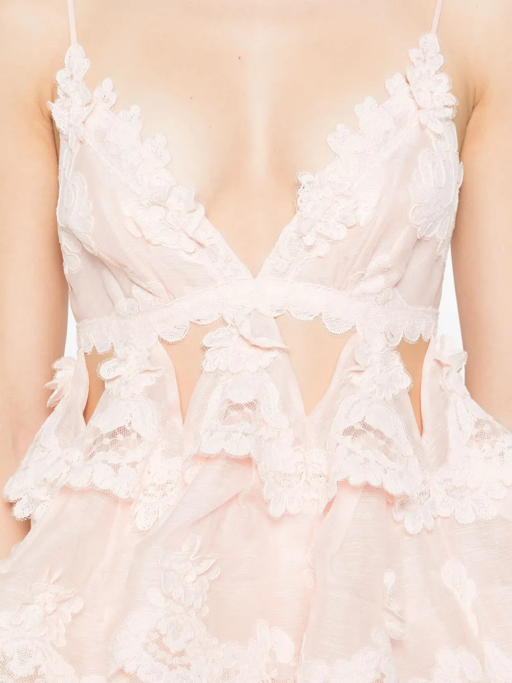 Elevate your style with the Zimmermann Tiered Lace Maxi Dress in delicate light pink. Featuring adjustable spaghetti straps and a flattering V-neck, this dress offers a perfect blend of comfort and elegance. The tiered lace design adds romantic texture, while the rear zip and clasp ensure a secure, tailored fit. Ideal for special occasions, it effortlessly combines sophistication with feminine charm.