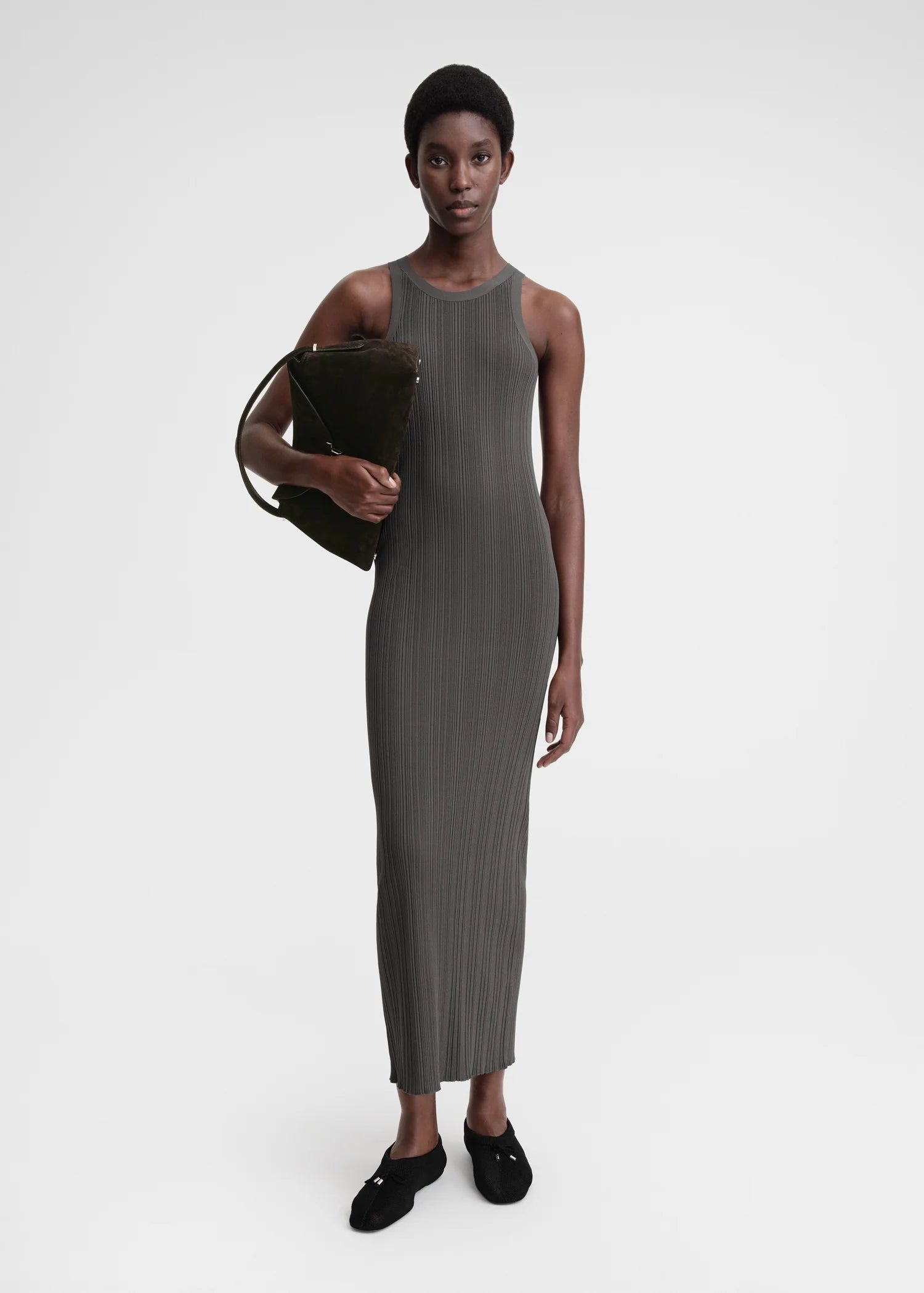 Elevate your style game with our TOTEME Khaki Seamless Midi Dress. Made from a luxurious rib knit blend of viscose and recycled nylon, this dress molds to your body for a flawless fit. Perfect for any occasion, this dress exudes sophistication and exclusivity.