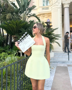 Introducing the Structured Mini Dress, the epitome of elegance and sophistication. Featuring a classic halter neck and lampshade skirt, it's a timeless piece that will elevate your style. With our signature cinch and Resort lime cream color, this dress is perfect for any event as it combines refinement with a touch of playfulness.