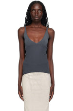 Load image into Gallery viewer, Effortlessly chic and versatile, the Che Tank Top by Paloma Wool features a rib knit cupro fabric for a comfortable and flattering fit. Show off your neckline with the rolled edge plunging V-neck and make a statement with the embroidered logo at the side seam. The fixed shoulder straps ensure a secure and stylish look.
