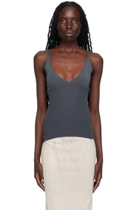 Effortlessly chic and versatile, the Che Tank Top by Paloma Wool features a rib knit cupro fabric for a comfortable and flattering fit. Show off your neckline with the rolled edge plunging V-neck and make a statement with the embroidered logo at the side seam. The fixed shoulder straps ensure a secure and stylish look.