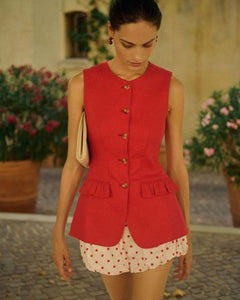 The Matilda Gilet, crafted from 100% linen in a striking red, combines elegance with versatility. Its jewel neckline and flared peplum hem create a refined silhouette, while the adjustable gold buckle at the back allows precise waist customization. Functional welt pockets feature delicate ruffle flaps that can be displayed for added style or concealed for a clean finish. Fully lined with a curved hemline and centre back split, this gilet offers both comfort and tailored sophistication for a polished look.