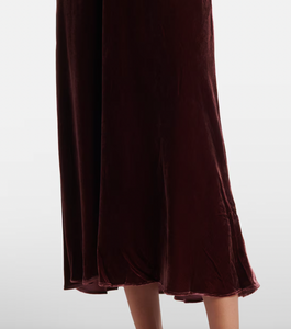 Indulge in luxury with the Clarice Dress, a perfect party-ready midi dress. Crafted from smooth velvet and delicate silk, this dress exudes elegance and softness. With its sophisticated design, you'll be the center of attention at any event.