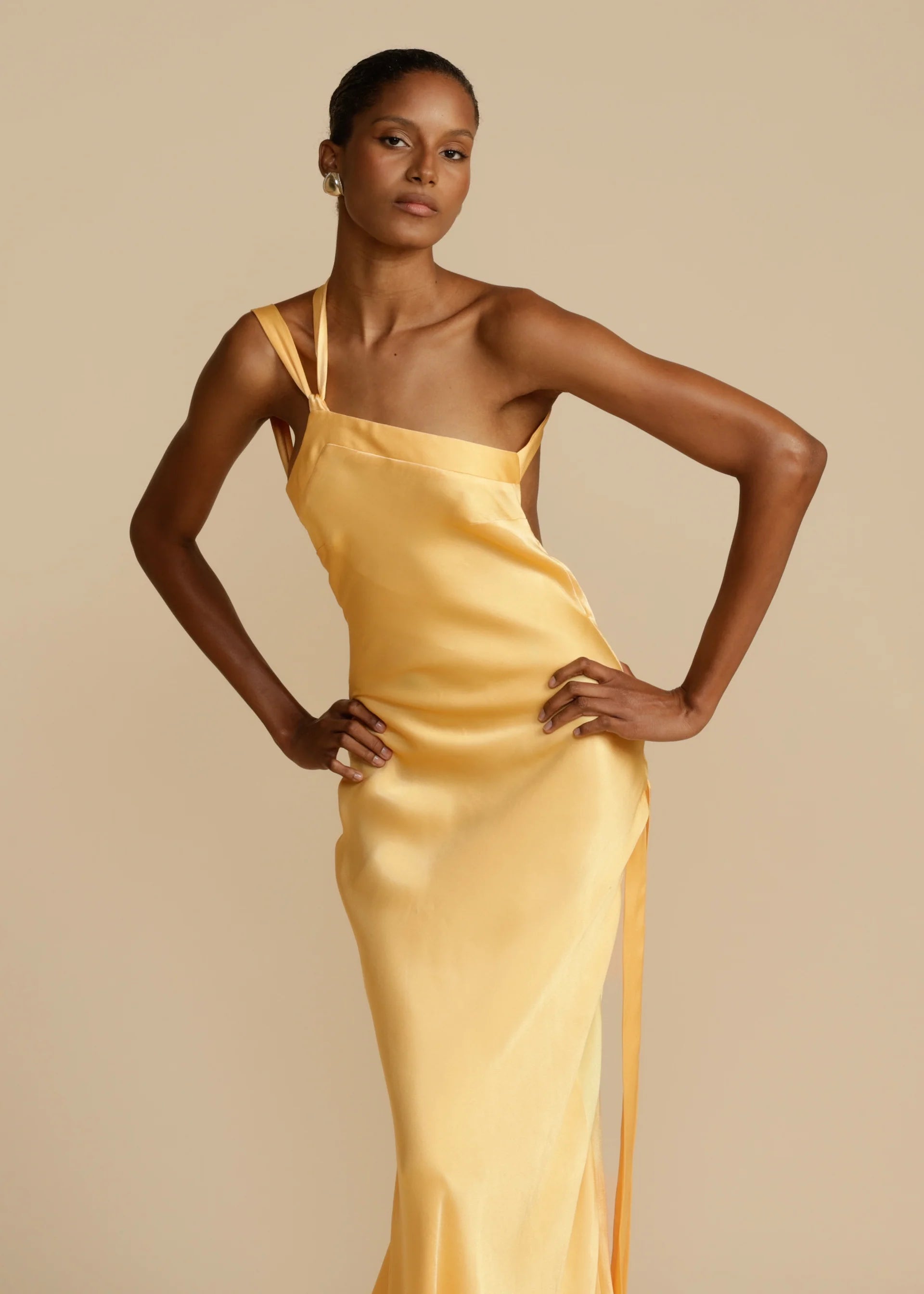 Indulge in luxury with our Micah Maxi Dress! Made from elegant silk, this stunning dress features an inclined shoulder, backless design, and sleeveless cut. Perfect for any occasion, it'll turn heads and make you feel like you're walking on a high street runway. Elevate your wardrobe with this chic and sophisticated Robe.