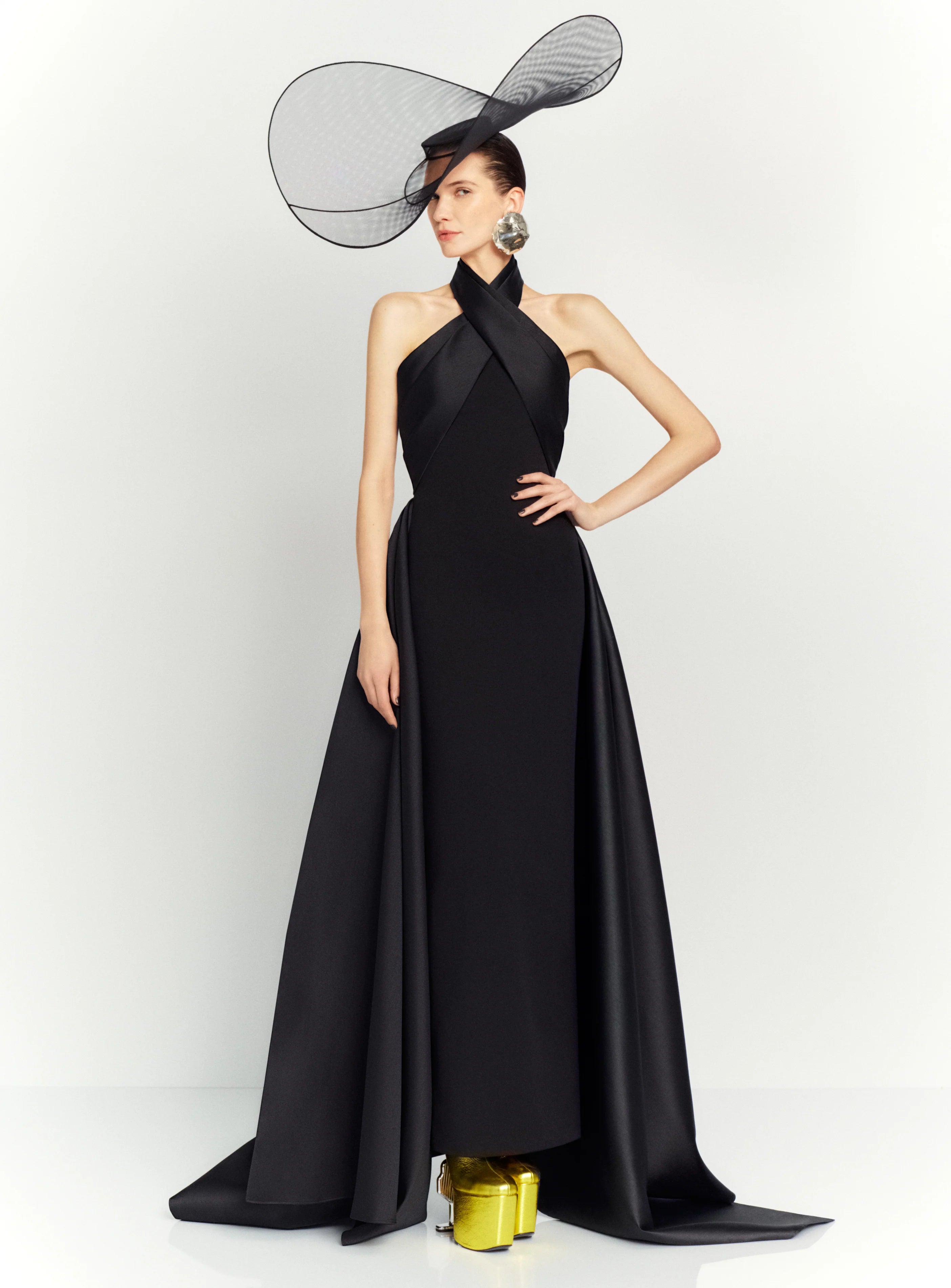 The dramatic silhouette of Solace London's 'Rumi' gown will ensure you'll make a memorable entrance. It's cut from stretch-crepe to hug your figure with glossy satin-twill that wraps around the neck and waist before falling at the sides to an asymmetric hem. Style yours with glittering earrings and elbow-length velvet gloves.