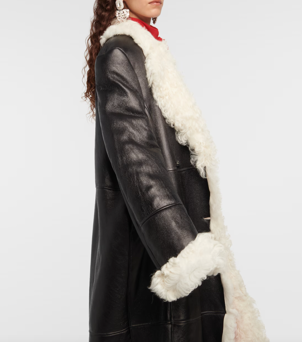 Indulge in luxury with the Magda Butrym Shearling-lined leather coat. Made with premium quality leather and lined with soft shearling, this coat offers both style and comfort. Perfect for chilly winter days, it is a must-have addition to your wardrobe. Elevate your fashion game with this sophisticated and exclusive piece.