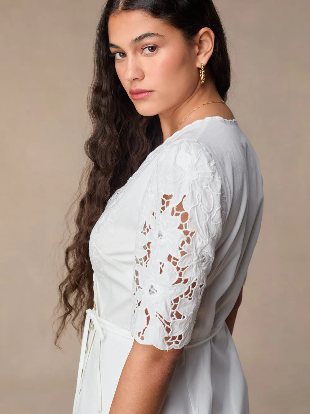 Transform your wardrobe with our Sara Midi Dress! This stunning white embroidered wrap dress exudes elegance and charm. Perfect for any occasion, its mid-length style offers a timeless silhouette that will flatter any body type. Make a statement with this must-have dress that will leave you feeling confident and beautiful.