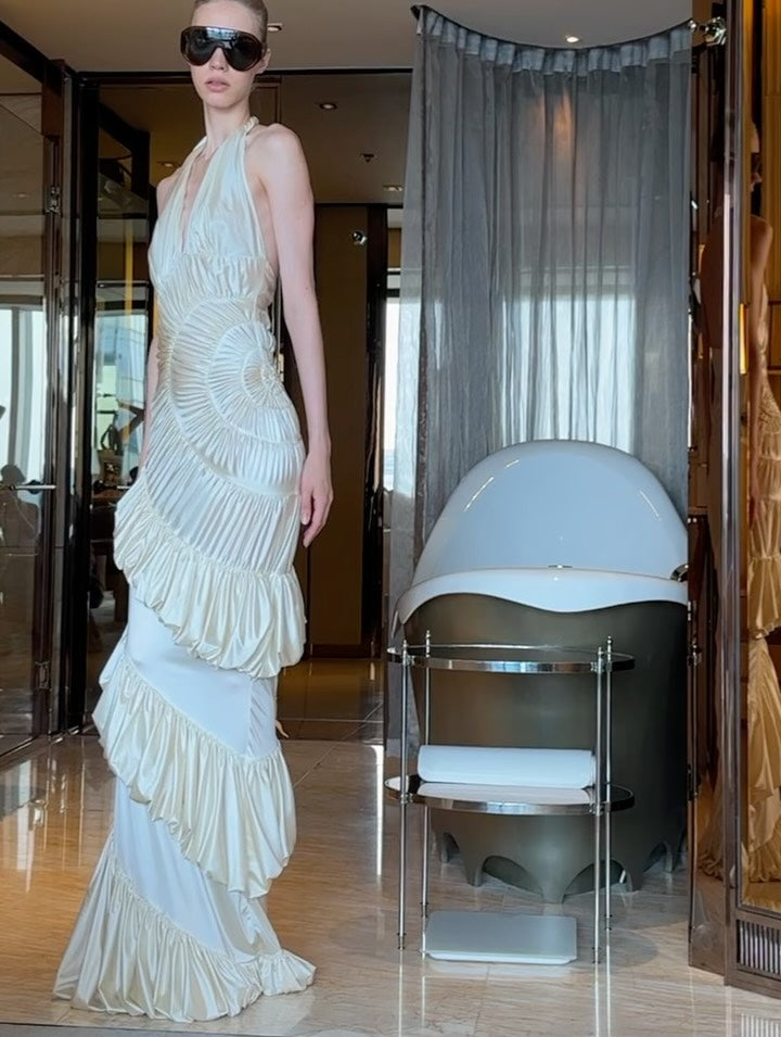 The Ammonite Gown by Datt combines elegance with practical comfort. Crafted from soft mesh that drapes beautifully against your skin, this fitted piece features a convenient side zip for effortless dressing. The included separate bikini lining ensures you're covered and confident underneath, making this gown versatile enough for any occasion where you want to feel polished and put-together.