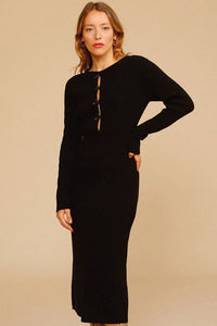 Experience effortless chic this autumn and winter with our Ines Midi Dress. Made from high-quality rib knit fabric, this vintage cutout dress features a figure-hugging silhouette, cascading cut-outs with bows, and a crew neckline. Perfect for work from home or dressing up on off-duty days. Complete the look with mid-calf heeled boots and a snakeskin baguette bag.