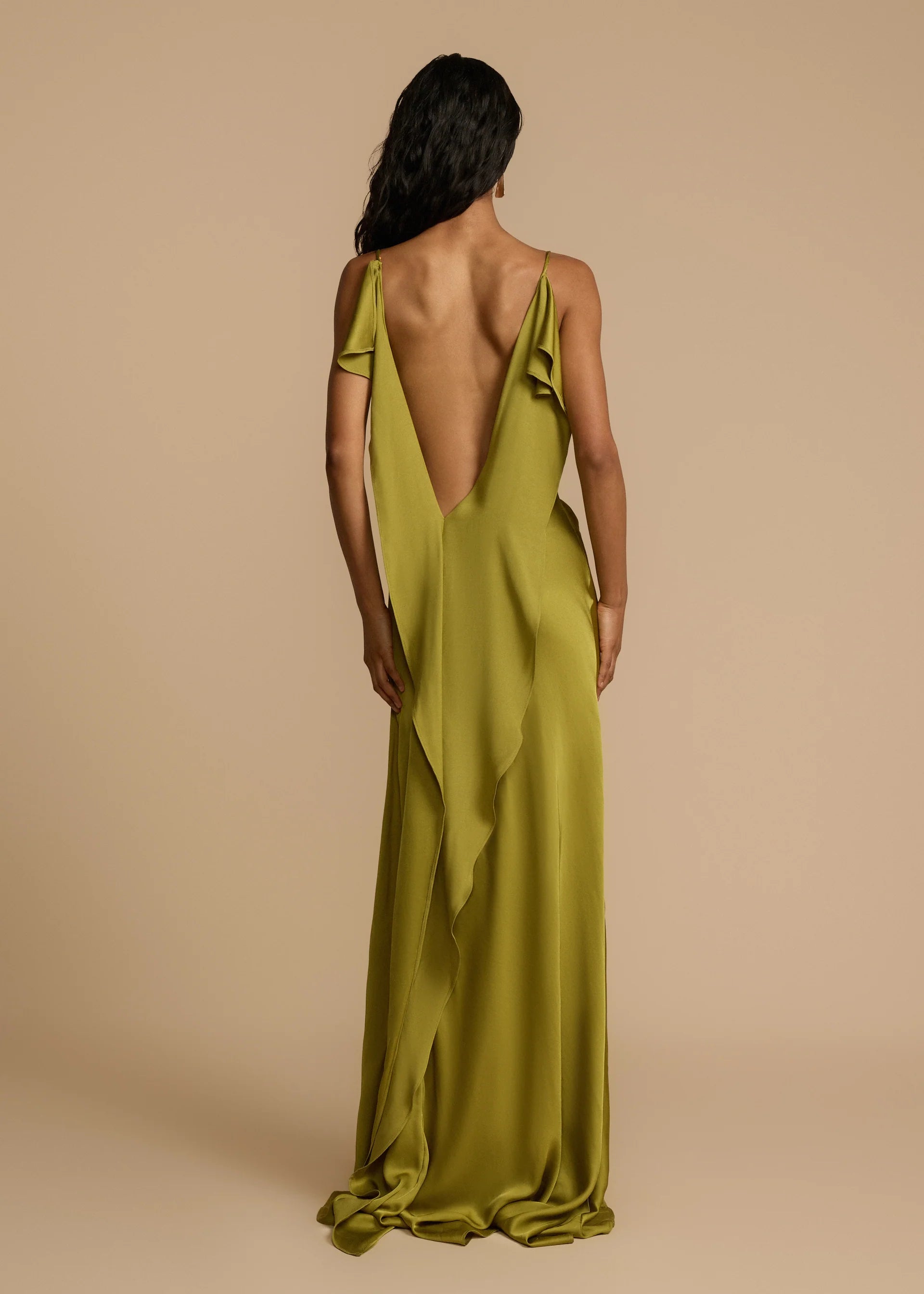 Looking for a dress that combines boldness and elegance? Look no further than the Odessa Dress! With subtle tucks at the side hip for structure and harmony, delicate spaghetti straps and a daring thigh-high slit, this dress is tailored to captivate. The asymmetrical deep V back and cascading satin details add the perfect finishing touches. Take a risk and stand out in the Odessa Dress.