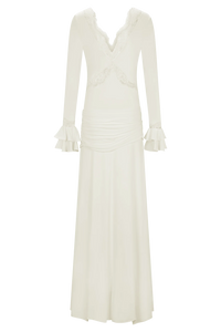 The Electra Maxi Dress combines elegant lace and a flattering fitted silhouette to create a captivating look. Its deep V lace neckline and delicate cut-outs add a touch of allure, while the cascading front-side tie drape enhances graceful movement. Flared layered sleeves bring a vintage charm, and the partial lining ensures comfort without compromising style. Perfect for making a memorable impression at any evening event, this dress shapes a sophisticated and sultry statement.