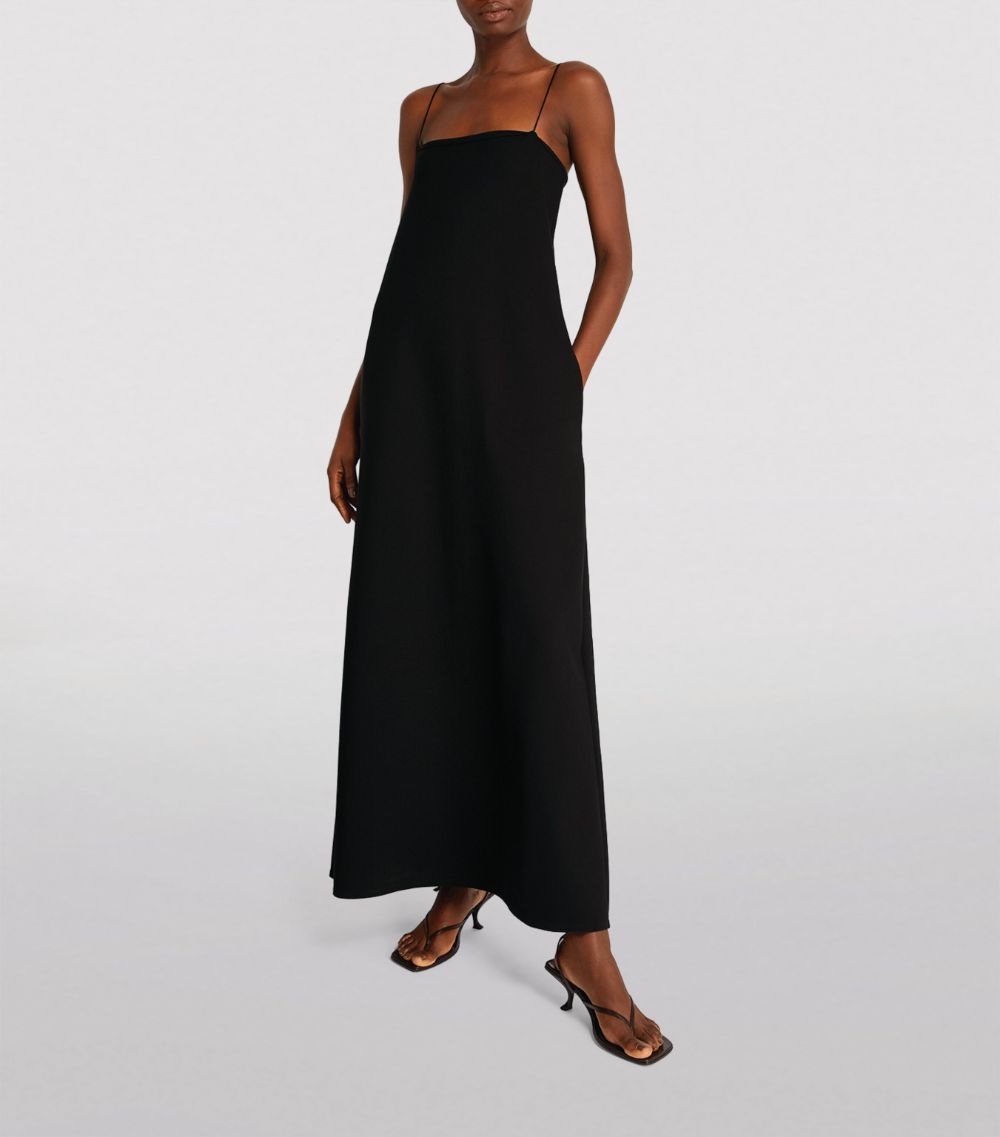 Effortlessly elegant, the Cenoa Maxi Dress from THE ROW is the perfect spring/summer staple. Designed with thin shoulder straps and a tall, floor length silhouette, this dress exudes an old money style that is both timeless and chic. A must-have for any wardrobe, the Cenoa Slip Dress offers versatile fashion for any occasion.