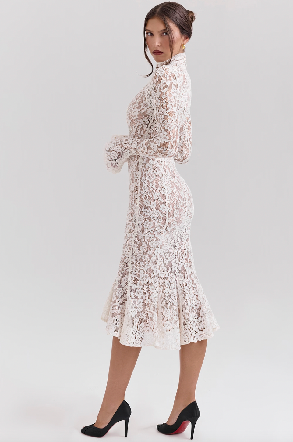 Get ready to turn heads with the Sophia Midi Dress. This dress combines modern flair and romantic elegance. Its body-hugging silhouette, high neck, and long sleeves beautifully highlight your shape while keeping it sophisticated. The ivory lace adds a touch of texture, and the fluted hem and cuffs add a playful twist to this timeless design.