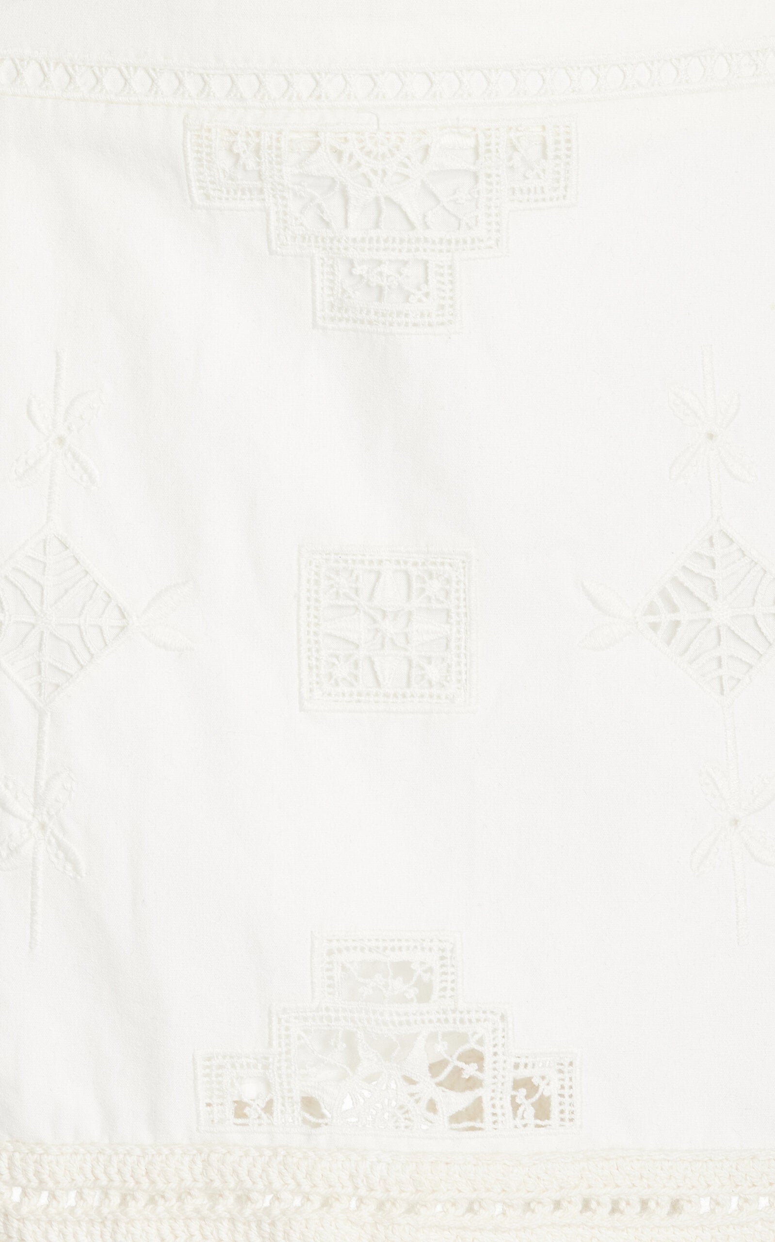 The Sanda Macrame-Trimmed Cotton Mini Skirt by Isabel Marant combines breathable cotton fabric with delicate embroidery and intricate macrame yarn tassels, offering both comfort and a refined artisanal touch. Ideal for warm weather, this skirt blends natural materials and expert craftsmanship to elevate your casual wardrobe with unique texture and style.