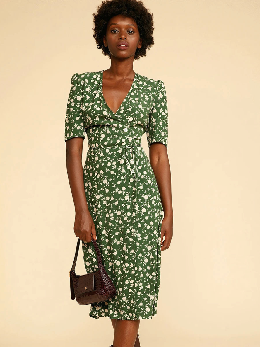 Indulge in classic elegance with our Anstasia Dress. The vintage floral print, short sleeves, and V-neck wrap create a charming silhouette, perfect for any summer occasion. The smooth fabric, delicate pattern, and graceful design combine to make this dress a must-have for any fashion-forward woman.